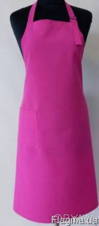 Фартук розовый с нагрудником 
Ткань: габардин (100%полиэстер).
Сбоку карман.
Тка. . фото 1
