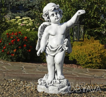 Садовая фигура ангела, держа в поднятой руке фонарь. Фигура выполнена в сером цв. . фото 1