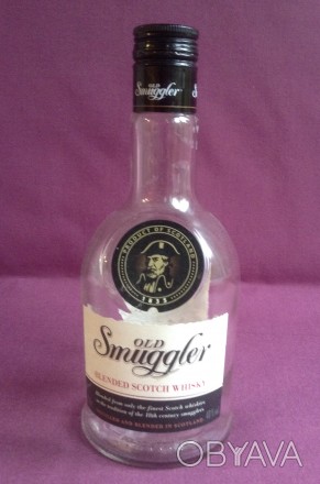 Бутылка от алкоголя Старый контрабандист.
Виски Old Smuggler. Стекло.
Высота 2. . фото 1