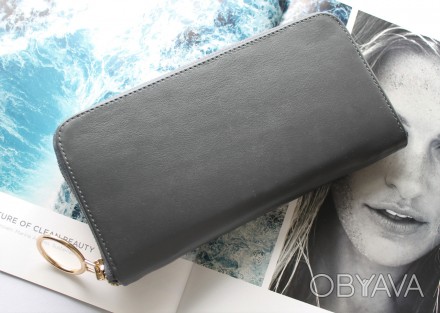 Женский удобный кожаный кошелек серого цвета
Стильный дизайн, отличное качество,. . фото 1