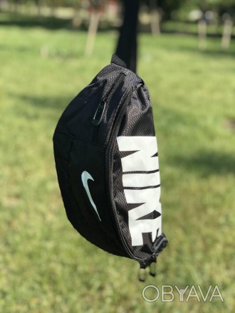 Наш видео обзор:
Описание:
Поясная сумка Nike Team Training – неотъемлемый атриб. . фото 1