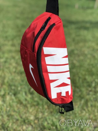 Наш видео обзор:
Описание:
Поясная сумка Nike Team Training (красная) – неотъемл. . фото 1