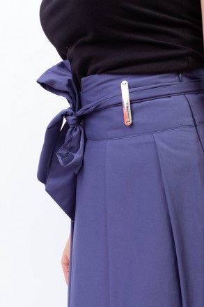 
Расклешенная юбка синего цвета с тканевым пояском на талии, производство Турция. . фото 6