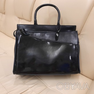 Модная кожаная женская сумочка. Совместима с форматом А4.
Элегантная сумка, каче. . фото 1