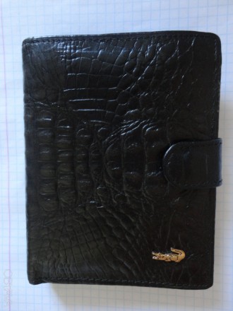 Кожаый мужской кошелек (черный)

Размер: 12.7 Х 9,7 см

Новый, Присутствуют . . фото 3