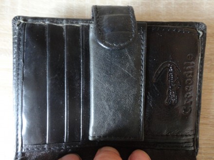 Кожаый мужской кошелек (черный)

Размер: 12.7 Х 9,7 см

Новый, Присутствуют . . фото 6