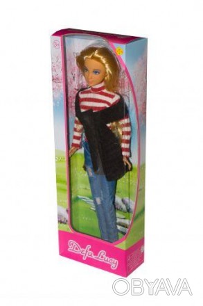 Красивая куколка блондинка в модном тёплом свитерке, шарфике, джинсах и туфелька. . фото 1