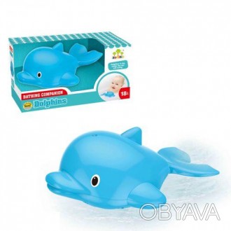 Пластиковая игрушка для ванной в форме дельфинчика. При контакте с водой дельфин. . фото 1