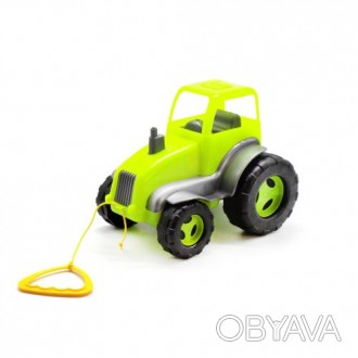 Яркий пластиковый трактор со шнурочком и ручкой, с помощью которого его удобно т. . фото 1