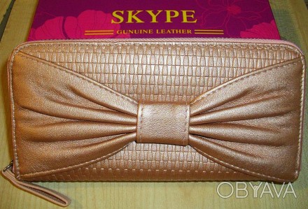Очень стильный женский кошелёк отличного качества. 
Длина-18,5 см.,высота 9 см. . . фото 1