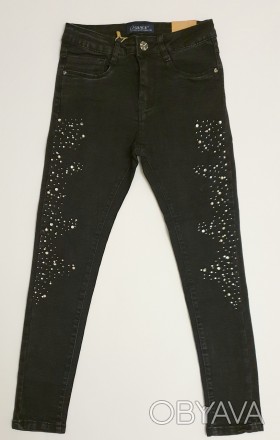 Черные стрейчевые джинсы для девочки
Украшены бусинками и стразами (на заклепках. . фото 1