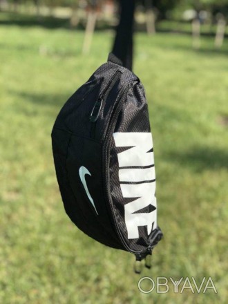 Наш видео обзор:Описание: Поясная сумка Nike Team Training – неотъемлемый атрибу. . фото 1