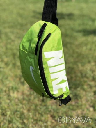 Наш відео огляд: Обмаль: Поясна сумка Nike Team Training (салатова) — невіддільн. . фото 1