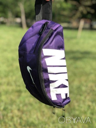 Наш відео огляд: Обмаль: Поясна сумка Nike Team Training (фіолетова) — невідділь. . фото 1