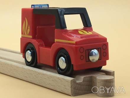 Пожарный игрушечный автомобиль со световыми и звуковыми эффектами.
Для детей от . . фото 1
