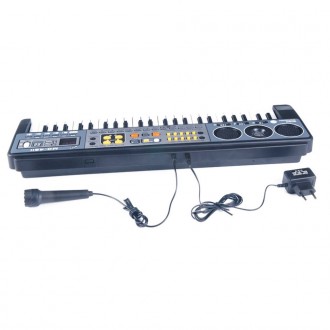 Синтезатор має 49 нотний клавішу. Музичний інструмент має безліч різних функцій,. . фото 9