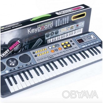 Синтезатор має 49 нотний клавішу. Музичний інструмент має безліч різних функцій,. . фото 1