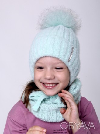 Теплая шапка на девочку
Теплая шапочка с завязками выполнена из мягкой пряжи, вн. . фото 1