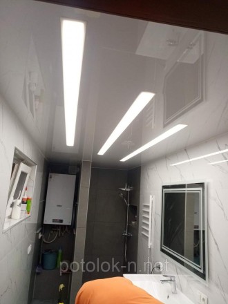 Натяжной потолок со световыми линиями в гостиную в Днепре
Натяжной потолок со св. . фото 5