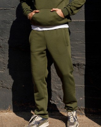 Теплые спортивные штаны выполненные из утепленного флисом трикотажа цвета хаки. . . фото 2