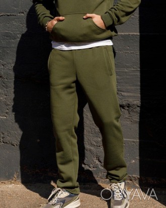 Теплые спортивные штаны выполненные из утепленного флисом трикотажа цвета хаки. . . фото 1