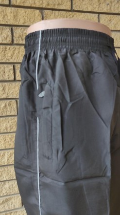Спортивные штаны мужские реплика NIKE, плащевка, без подкладки.
Имеются 2 боковы. . фото 6