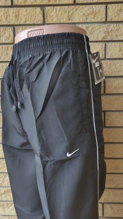Спортивные штаны мужские реплика NIKE, плащевка, без подкладки.
Имеются 2 боковы. . фото 5
