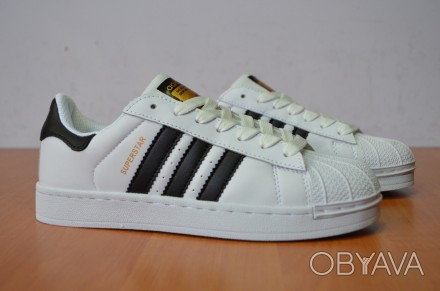 КРОССОВКИ SUPERSTAR
ALL THE AUTHENTIC LINES AND DETAILS OF THE ORIGINAL ADIDAS S. . фото 1