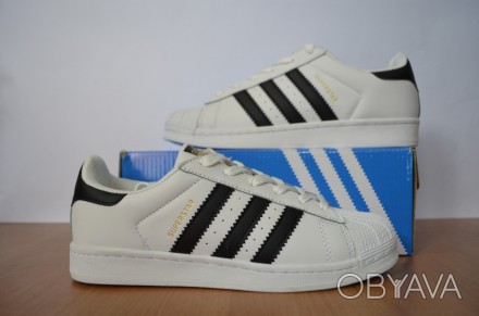 КРОССОВКИ SUPERSTAR
ALL THE AUTHENTIC LINES AND DETAILS OF THE ORIGINAL ADIDAS S. . фото 1