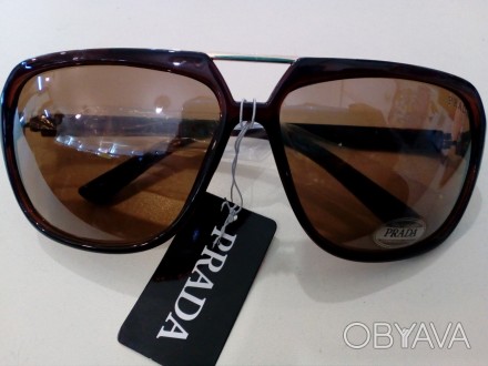 Предлагаем Вам купить солнцезащитные очки Prada.
Расстояние от ушка до ушка 14-1. . фото 1