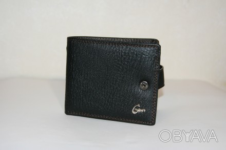 Мужское портмоне  - стильный бумажник, который сделан из кожи. Портмоне имеет ст. . фото 1