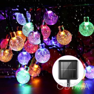 
Светодиодная гирлянда на солнечной батарее "Хрустальные шарики"– праздничное ук. . фото 1